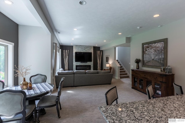 2203 N 188th Ave, Elkhorn, NE 68022 - carpeted dining space featuring a large fireplace, stairway, and recessed lighting