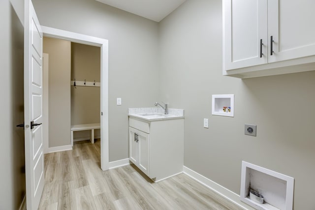 3938 S 207th St, Elkhorn, NE 68022 - laundry room featuring electric dryer hookup, light wood-type flooring, washer hookup, and cabinet space