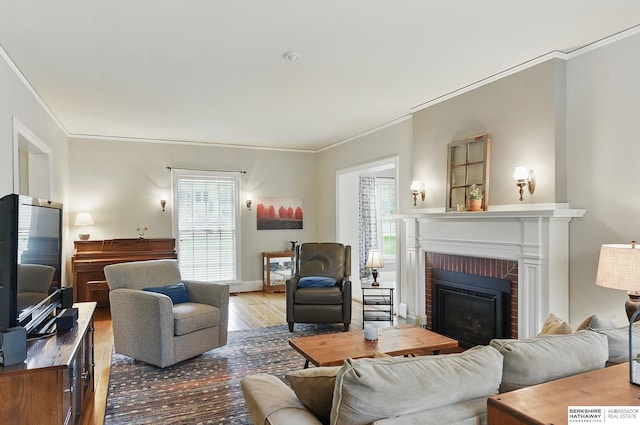 5119 Hamilton St, Omaha, NE 68132 - living room with wood finished floors, plenty of natural light, ornamental molding, and a fireplace