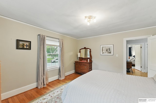 5119 Hamilton St, Omaha, NE 68132 - bedroom featuring light wood-style flooring, ornamental molding, and baseboards