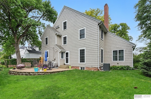 5119 Hamilton St, Omaha, NE 68132 - rear view of property with a patio area, central air condition unit, and a chimney