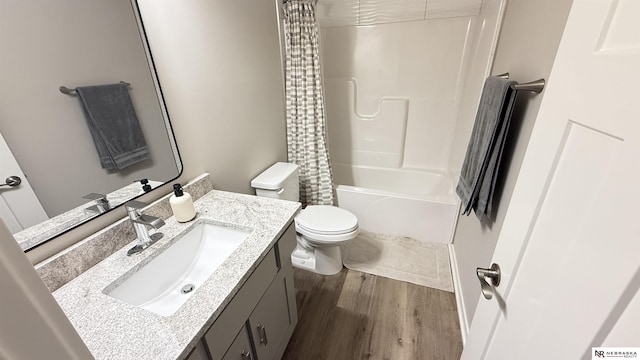 12667 161st Ave, Bennington, NE 68007 - bathroom featuring vanity, toilet, shower / bath combination with curtain, and wood finished floors