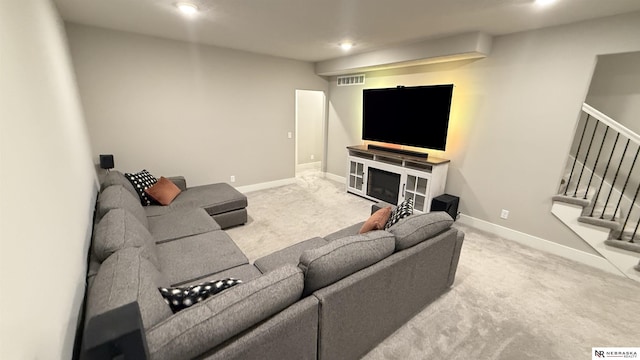 12667 161st Ave, Bennington, NE 68007 - carpeted living area featuring stairs, recessed lighting, and baseboards