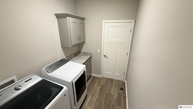12667 161st Ave, Bennington, NE 68007 - laundry area with washer and clothes dryer, cabinet space, and light wood finished floors