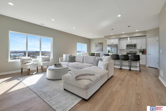 350 N 105th St, Lincoln, NE 68527 - living room featuring light wood finished floors, recessed lighting, and baseboards