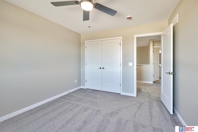 350 N 105th St, Lincoln, NE 68527 - unfurnished bedroom featuring carpet, baseboards, a closet, and a ceiling fan