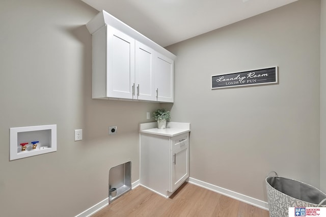 350 N 105th St, Lincoln, NE 68527 - washroom featuring cabinet space, washer hookup, light wood-style floors, electric dryer hookup, and baseboards