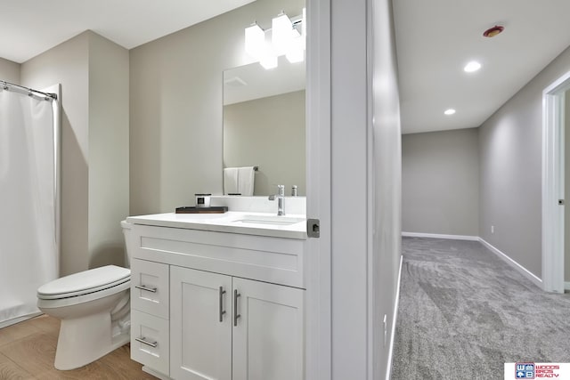 350 N 105th St, Lincoln, NE 68527 - bathroom with toilet, vanity, curtained shower, recessed lighting, and baseboards