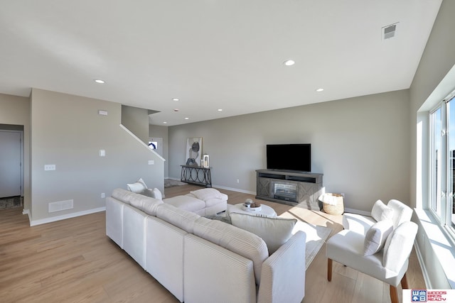 350 N 105th St, Lincoln, NE 68527 - living area with light wood-type flooring, baseboards, and recessed lighting