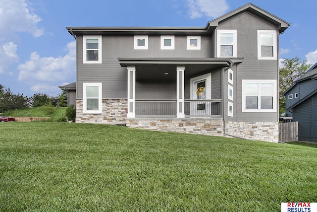 10202 N 152nd Ave, Bennington, NE 68007 - view of front of home featuring stone siding, a front yard, and a porch