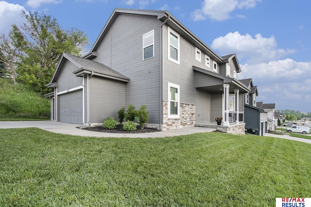 10202 N 152nd Ave, Bennington, NE 68007 - view of side of property featuring a lawn, stone siding, driveway, and a garage
