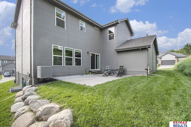10202 N 152nd Ave, Bennington, NE 68007 - back of property with cooling unit, a lawn, a patio area, and entry steps