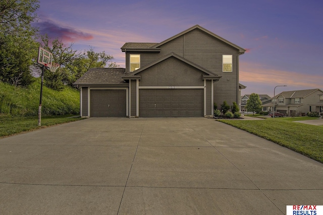 10202 N 152nd Ave, Bennington, NE 68007 - traditional home featuring driveway, a yard, and an attached garage