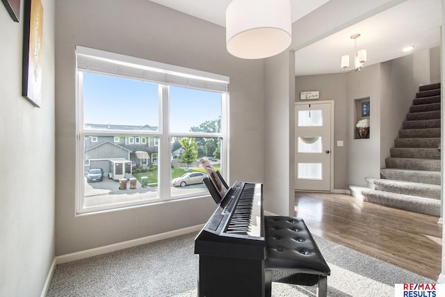 10202 N 152nd Ave, Bennington, NE 68007 - entrance foyer featuring baseboards, stairs, a chandelier, and carpet floors