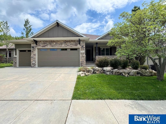 4640 Firebush Ln, Lincoln, NE 68516 - view of front of property featuring board and batten siding, an attached garage, a front yard, driveway, and a porch
