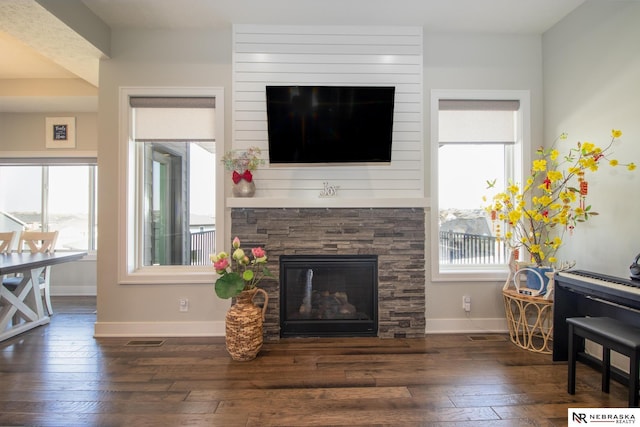 7316 Gerald Ave, Lincoln, NE 68516 - living room with a fireplace, hardwood / wood-style flooring, and baseboards