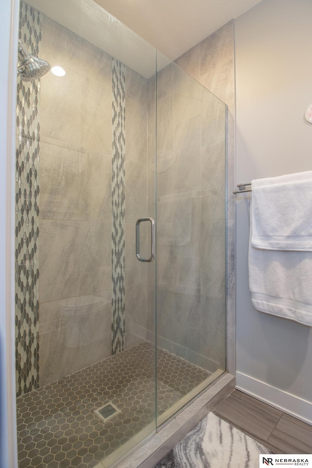 7316 Gerald Ave, Lincoln, NE 68516 - full bathroom with a shower stall and baseboards