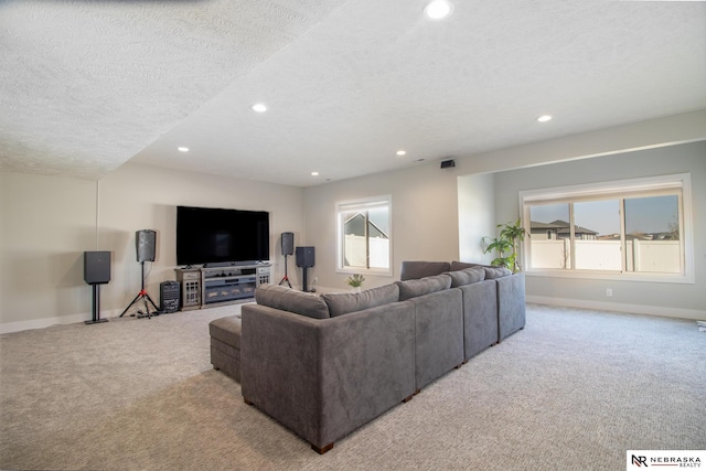 7316 Gerald Ave, Lincoln, NE 68516 - carpeted living room with recessed lighting, plenty of natural light, baseboards, and a textured ceiling