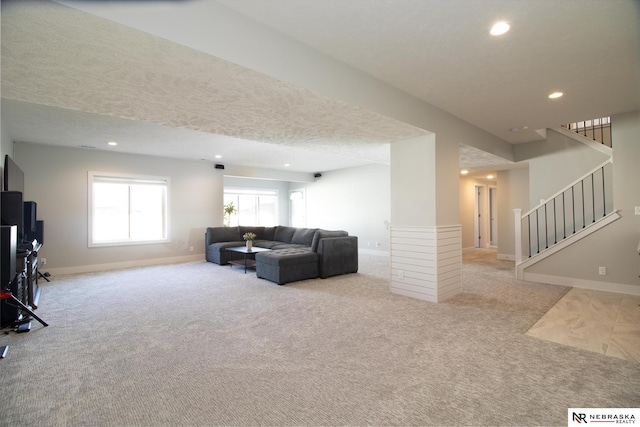 7316 Gerald Ave, Lincoln, NE 68516 - living area with carpet flooring, baseboards, recessed lighting, stairway, and a textured ceiling