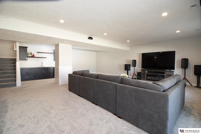 7316 Gerald Ave, Lincoln, NE 68516 - living area featuring light colored carpet, recessed lighting, stairs, and bar