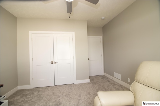 7316 Gerald Ave, Lincoln, NE 68516 - living area with carpet flooring, a ceiling fan, and baseboards