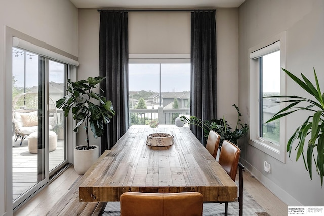 1611 S 208th St, Omaha, NE 68022 - dining room featuring light wood-style flooring and baseboards