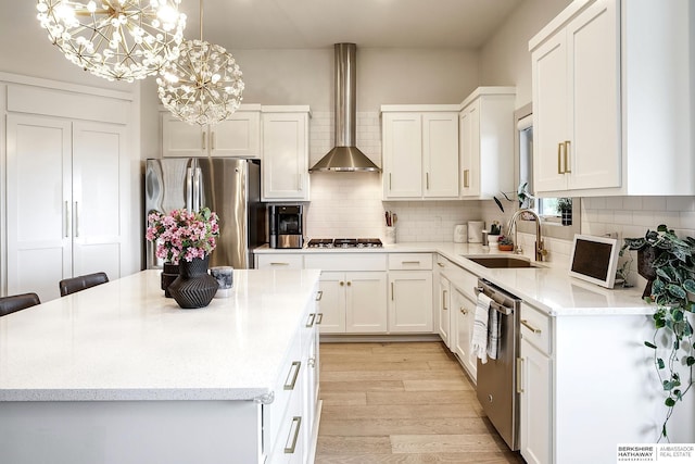 1611 S 208th St, Omaha, NE 68022 - kitchen with stainless steel appliances, wall chimney range hood, a sink, and white cabinetry