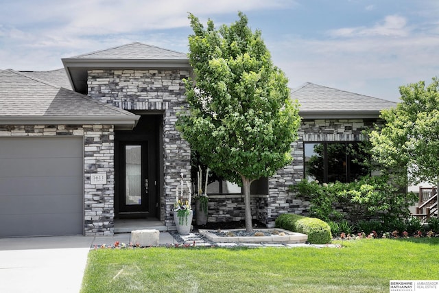 1611 S 208th St, Omaha, NE 68022 - view of front of home with an attached garage, stone siding, a front lawn, and a shingled roof