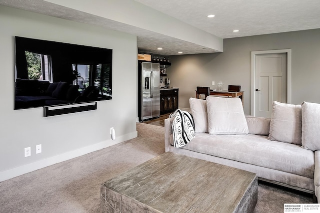 1611 S 208th St, Omaha, NE 68022 - carpeted living room featuring recessed lighting, baseboards, and a textured ceiling