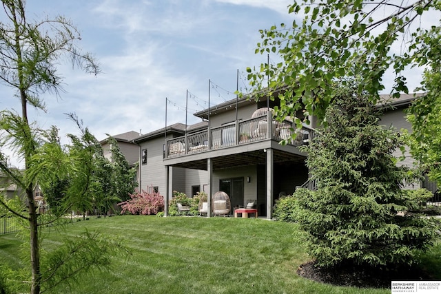1611 S 208th St, Omaha, NE 68022 - back of property featuring a lawn and a wooden deck