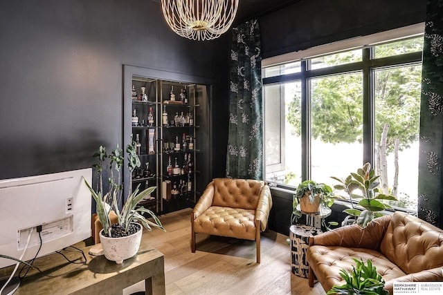 1611 S 208th St, Omaha, NE 68022 - living area featuring wood finished floors and a chandelier