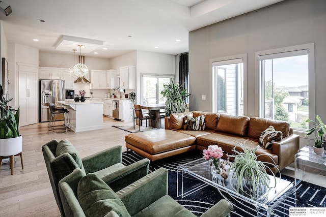 1611 S 208th St, Omaha, NE 68022 - living area featuring light wood finished floors, recessed lighting, and a towering ceiling