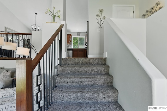 5135 N 159th Cir, Omaha, NE 68116 - stairway featuring a towering ceiling and a chandelier
