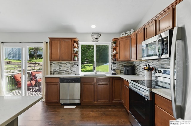 5135 N 159th Cir, Omaha, NE 68116 - kitchen featuring stainless steel appliances, open shelves, a sink, light countertops, and backsplash