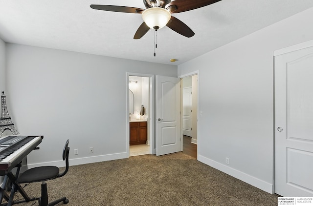 5135 N 159th Cir, Omaha, NE 68116 - office area with dark colored carpet, ceiling fan, and baseboards