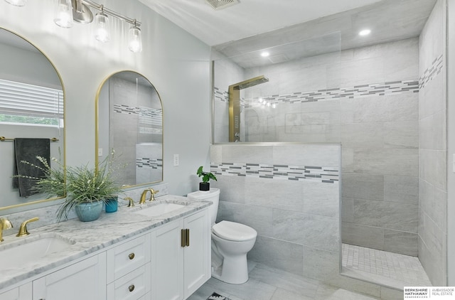 5135 N 159th Cir, Omaha, NE 68116 - bathroom with a walk in shower, toilet, double vanity, and recessed lighting