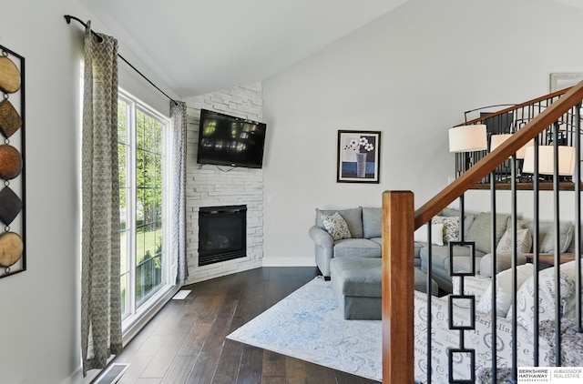 5135 N 159th Cir, Omaha, NE 68116 - living room with stairs, a stone fireplace, hardwood / wood-style floors, baseboards, and high vaulted ceiling