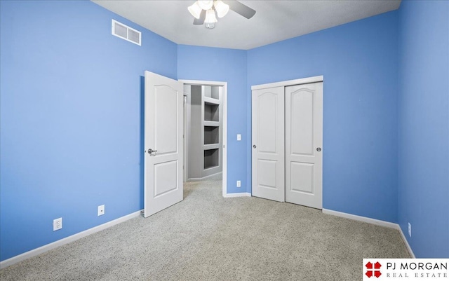 6713 N 148th St, Omaha, NE 68116 - unfurnished bedroom featuring carpet flooring, a closet, and a ceiling fan