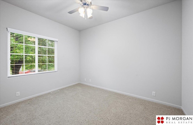 6713 N 148th St, Omaha, NE 68116 - carpeted spare room featuring ceiling fan and baseboards