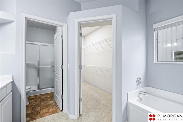 6713 N 148th St, Omaha, NE 68116 - full bath featuring a bath, a stall shower, vanity, and a spacious closet