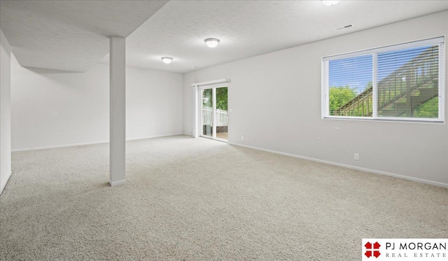 6713 N 148th St, Omaha, NE 68116 - carpeted spare room featuring baseboards and a textured ceiling