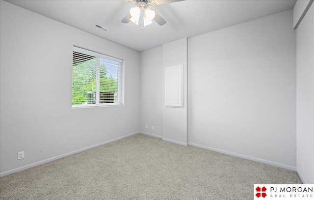 6713 N 148th St, Omaha, NE 68116 - empty room featuring carpet flooring and a ceiling fan