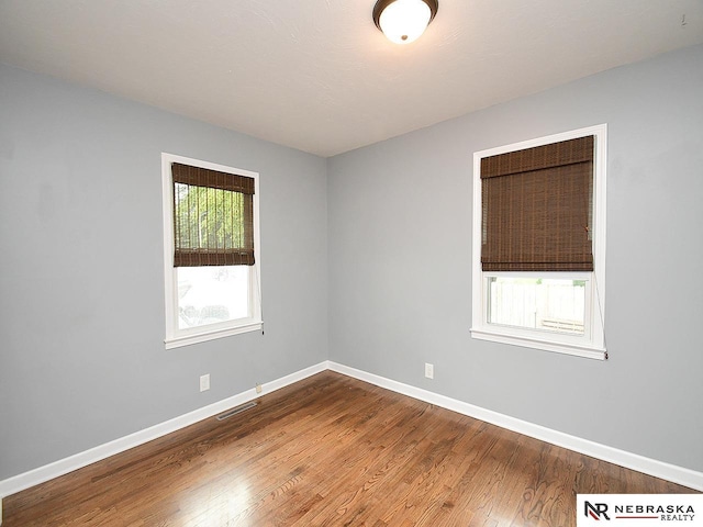 2000 N 53rd St, Lincoln, NE 68504 - unfurnished room with dark wood-style floors and baseboards
