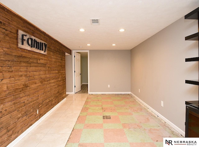 2000 N 53rd St, Lincoln, NE 68504 - spare room with wood walls and recessed lighting