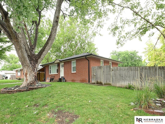 2000 N 53rd St, Lincoln, NE 68504 - rear view of property featuring brick siding