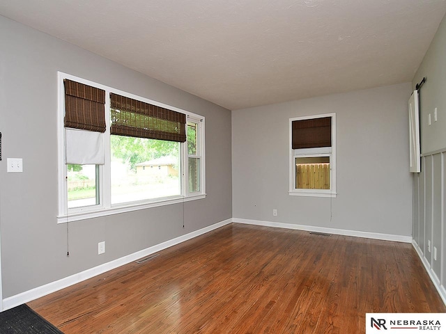 2000 N 53rd St, Lincoln, NE 68504 - empty room with wood finished floors and baseboards