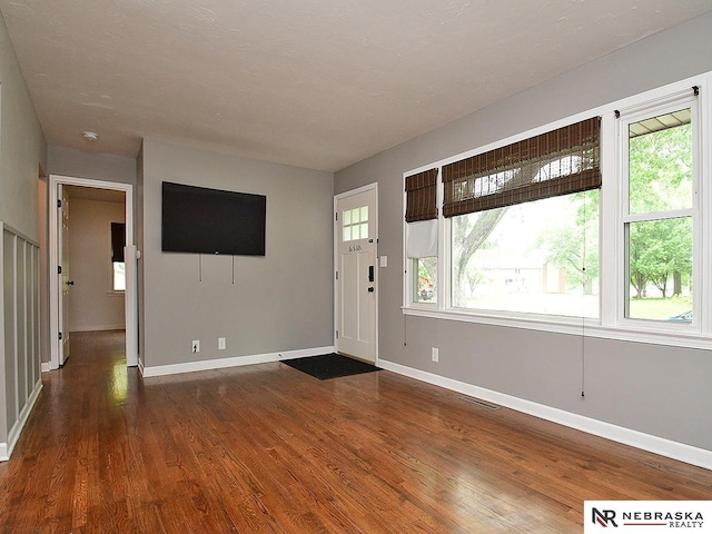 2000 N 53rd St, Lincoln, NE 68504 - foyer entrance with dark wood-style floors and baseboards