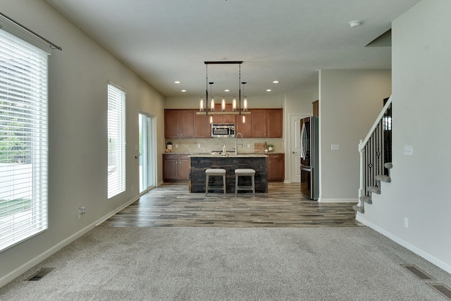 18337 Polk St, Omaha, NE 68135 - kitchen featuring appliances with stainless steel finishes, light countertops, plenty of natural light, baseboards, and recessed lighting
