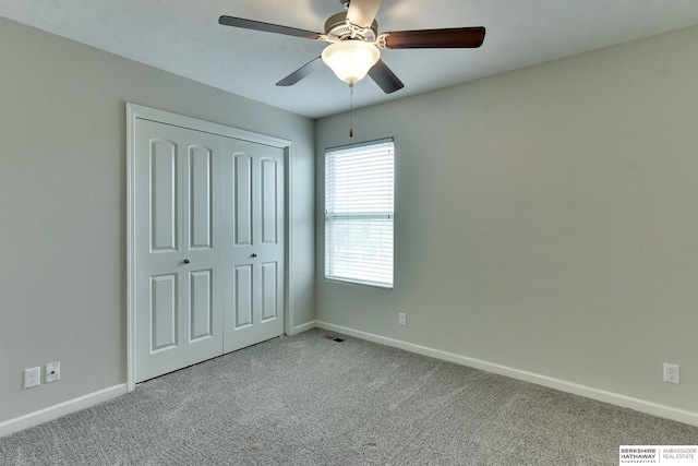 18337 Polk St, Omaha, NE 68135 - unfurnished bedroom featuring carpet flooring, baseboards, a closet, and a ceiling fan