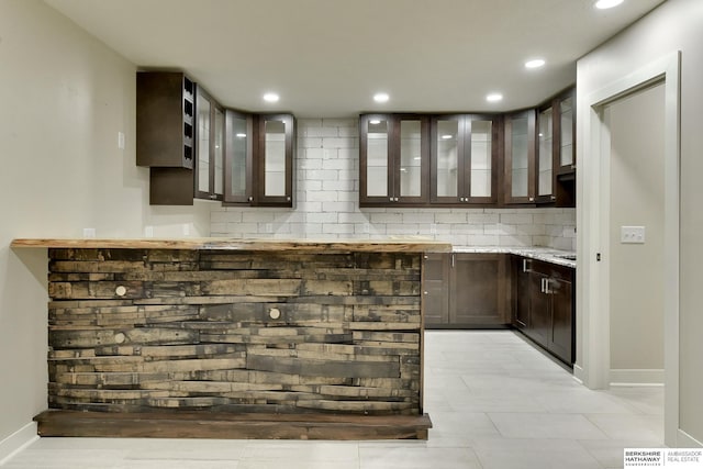 18337 Polk St, Omaha, NE 68135 - bar featuring tasteful backsplash, baseboards, and recessed lighting